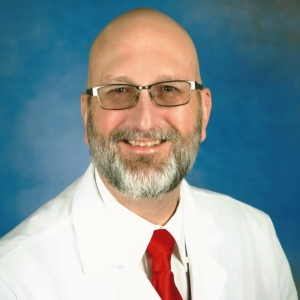 A headshot photo of doctor Thomas Claringbold