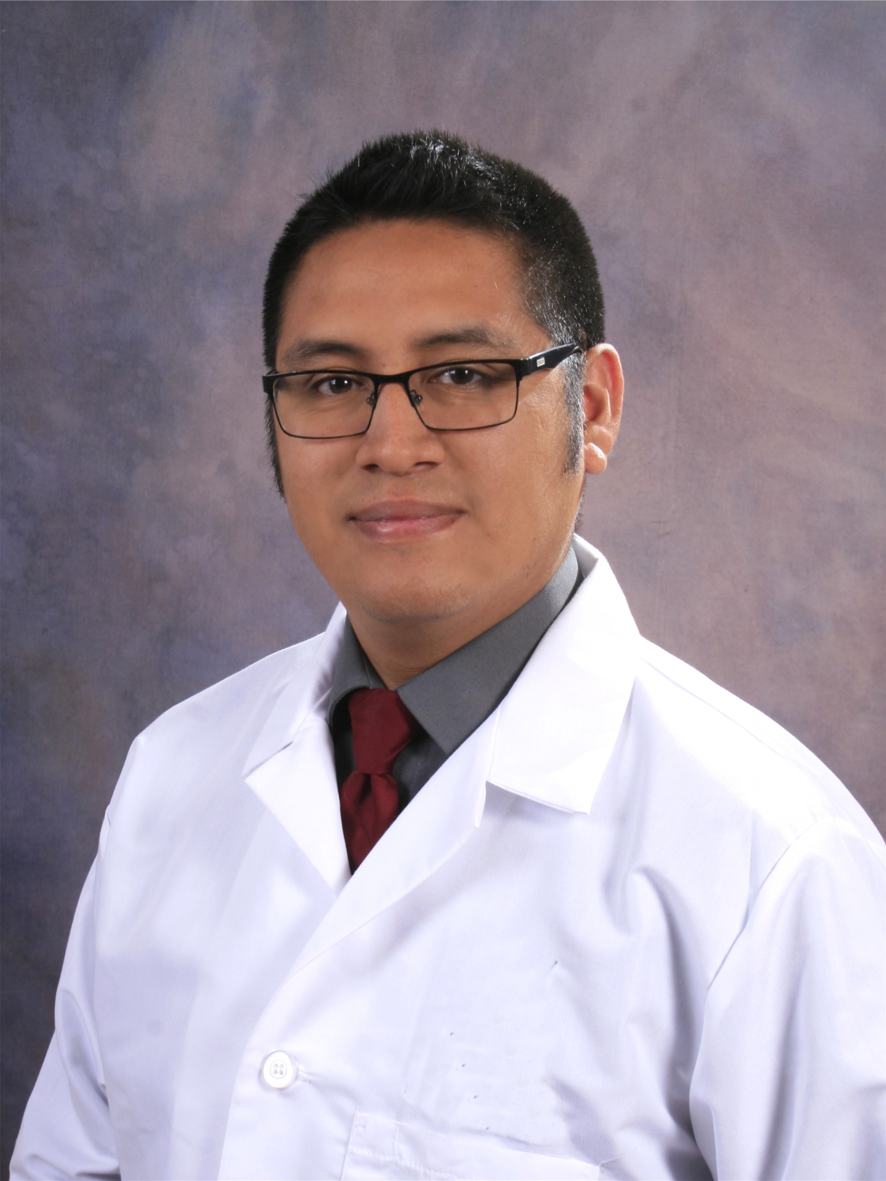 A headshot photo of Dr. Ruben Kenny Briceno