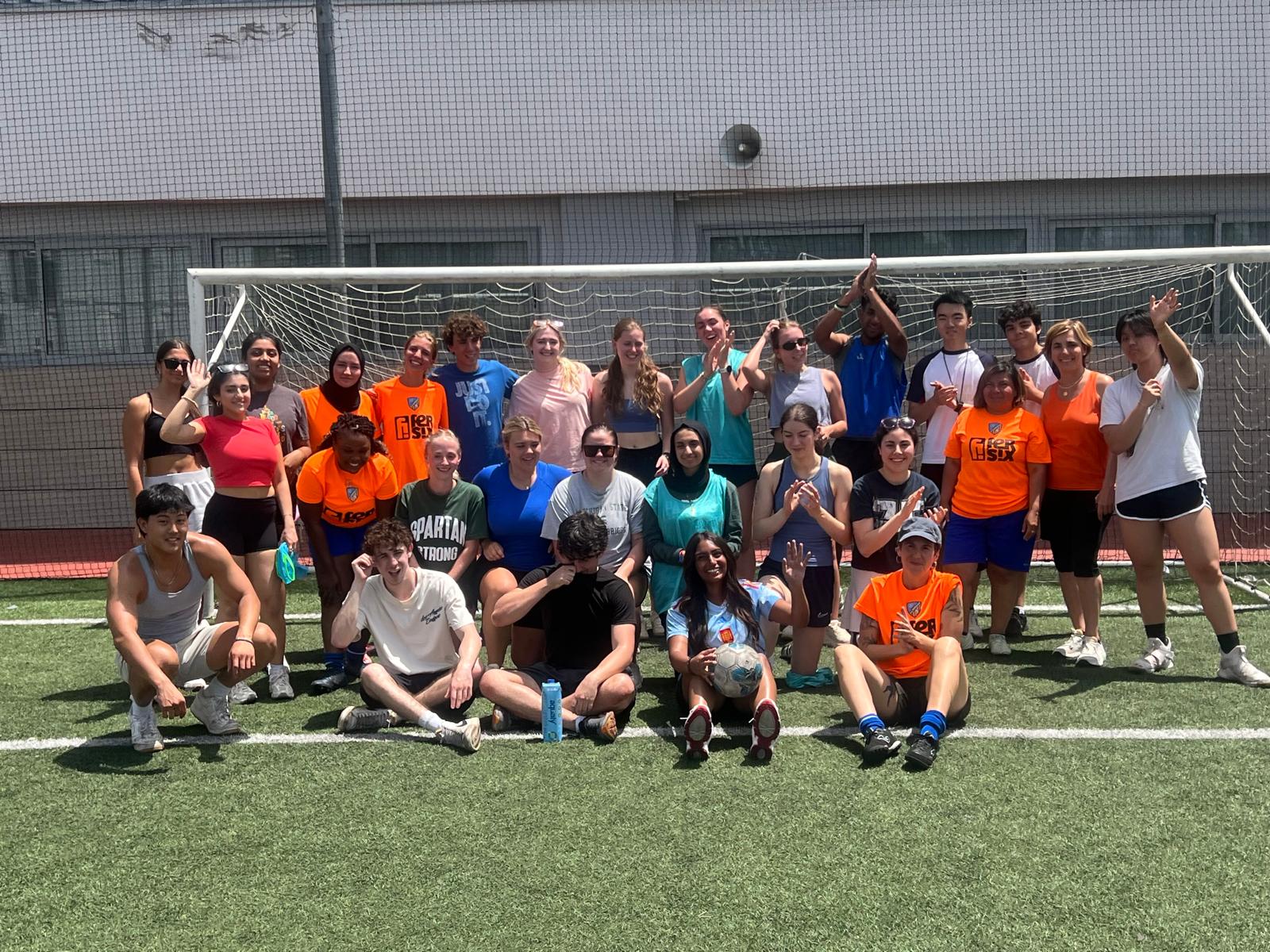 Ava Richardson, along with her cohort of MSU Spain program students, pose for a group photo after a soccer match.
